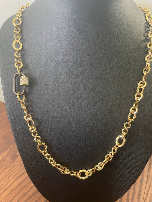 Gold links and carabiner